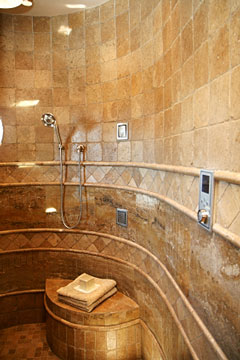 custom shower with bench and curved wall