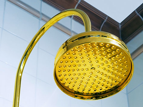 ceramic tile shower stall with brass showerhead